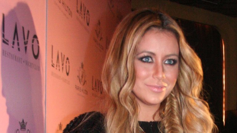 Singer Aubrey O'Day with long blonde hair at a 2011 event