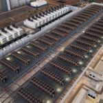 Rows of cooling units and generators on a data center roof