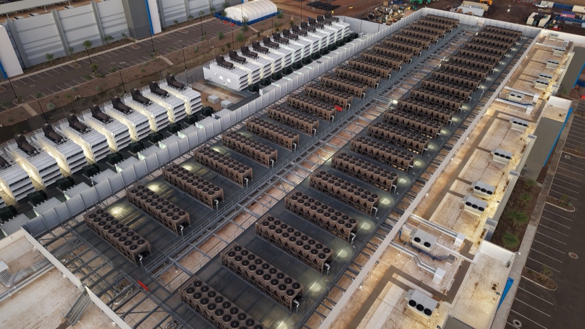 Rows of cooling units and generators on a data center roof