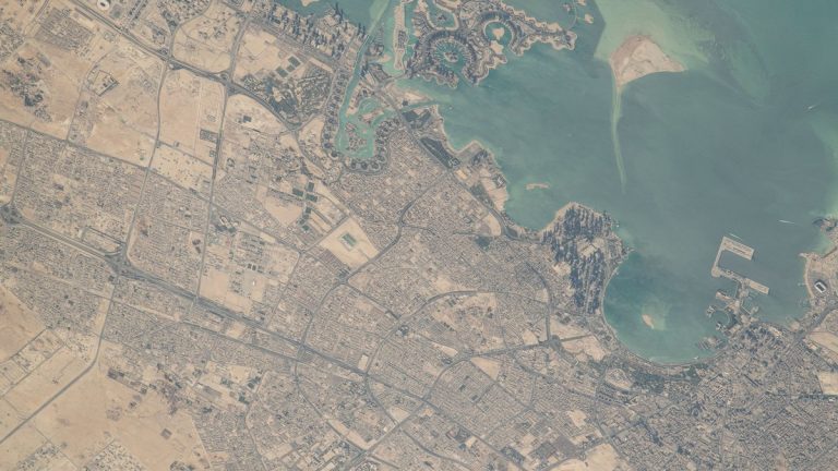 Satellite-style view of Doha, Qatar, with its coastline, man-made islands and city grid