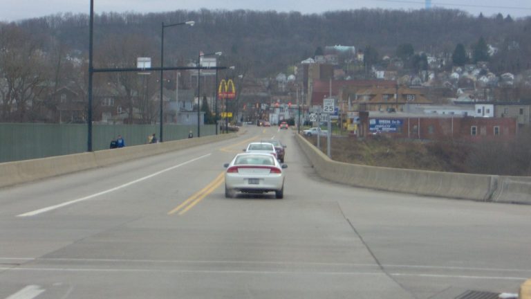 Road crossing a bridge into downtown Ellwood City, Pennsylvania