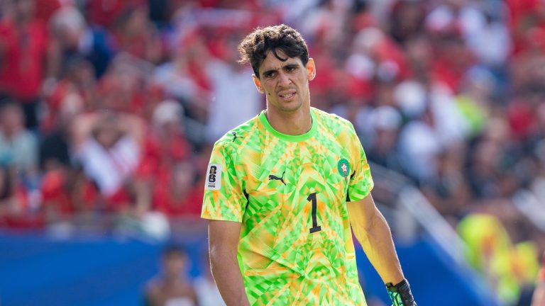 Yassine Bounou in a bright green Morocco goalkeeper jersey with the number 1 on the field